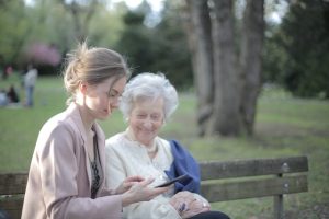 NYC estate planning, image of elder womqn with younger woman on a park bench