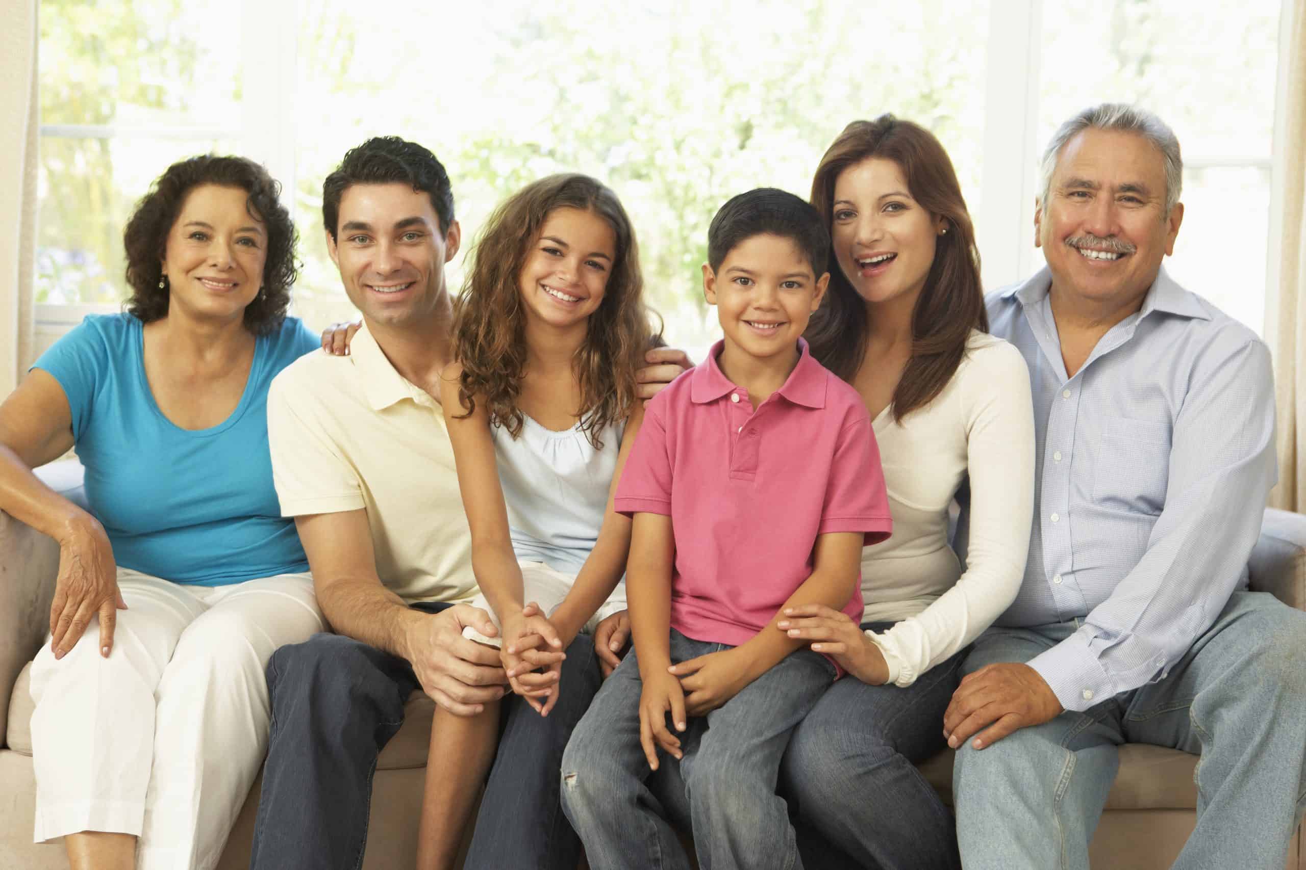 Extended Family Relaxing At Home Together
