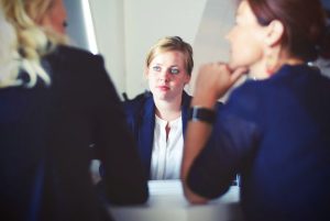 why would I need a trust, image of a woman at a meeting